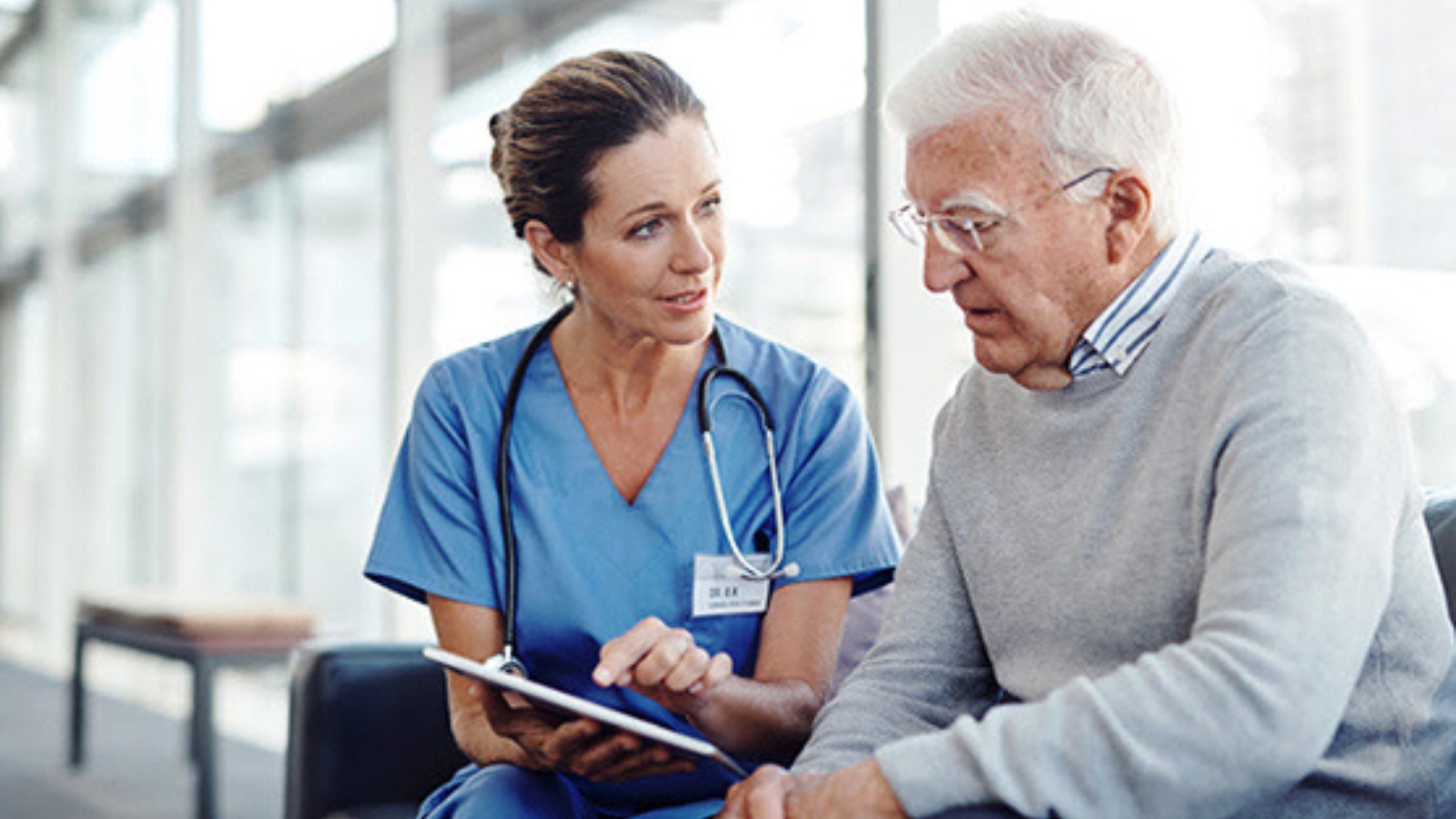 Clinician and patient discussing care